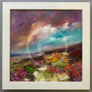 Framed painting of a landscape with colorful sky and earth tones.