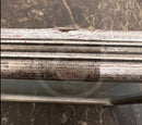 Damage to the back of the top section of the frame