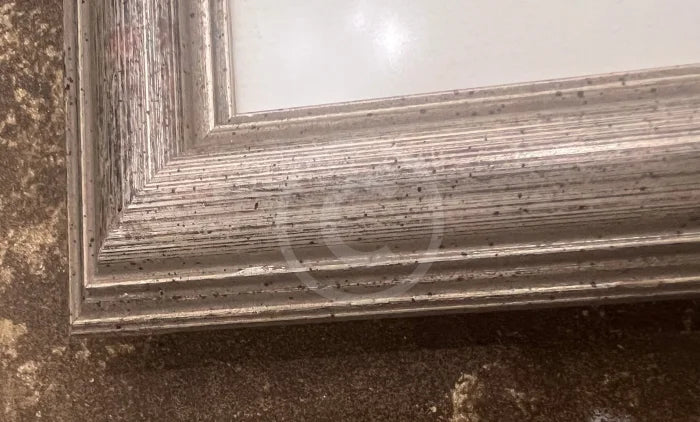 A small dent on the right hand corner of the frame