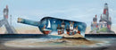 The Clock Tower by Gary Walton — giant glass bottle resting on a sandbank in the sea containing a miniature night scene with a clock tower building, row of wonky cottages and a sailboat under a starry teal sky and crescent moon, lighthouse on rocks to the right and harbour wall with gas lamp to the left
