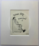 Ernest Hemingway Mustard is relaxing in a deep plaid armchair, with Doris the dog