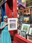 Artist Dotty Earl with her latest print Waterside Stroll