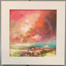 Framed artwork of a colorful landscape with a dynamic sky.
