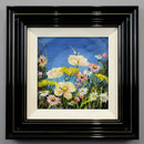 Moonlit Daisies by Rozanne Bell — white and yellow flowers with small pink blooms and green stems against a deep blue background, presented in a glossy black frame with a cream inner slip