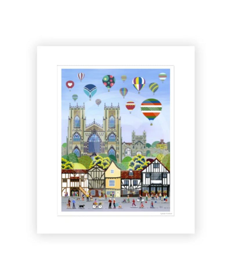 York Balloon Fiesta contemporary colourful mounted art print by Linda Mellin. York Minster with hot air balloons, portrait shaped cityscape. 