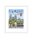 York Balloon Fiesta contemporary colourful art print by Linda Mellin. York Minster with hot air balloons, portrait shaped cityscape. White frame. 