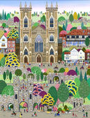 A colorful illustrated scene centered on a large cathedral with towers, surrounded by houses, trees, people, bicycles, and stone walls in a playful, postcard-style drawing.