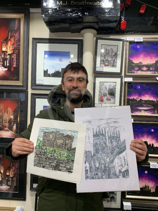 Artist Shaun Wyatt with his linocut prints.